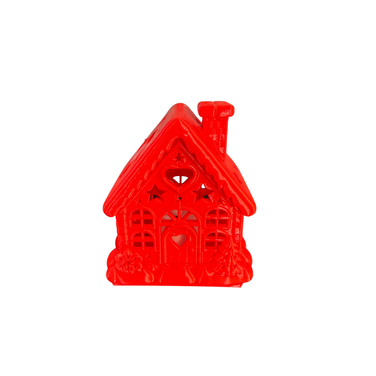 Front view of red Christmas Cottage LED Tealight Holder with chimney and heart-shaped door detail