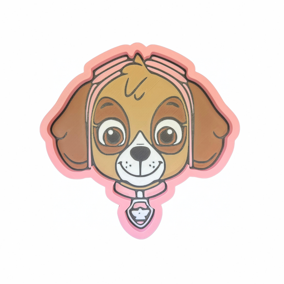 Brown puppy character face-shaped trinket tray with pink edging on a white background