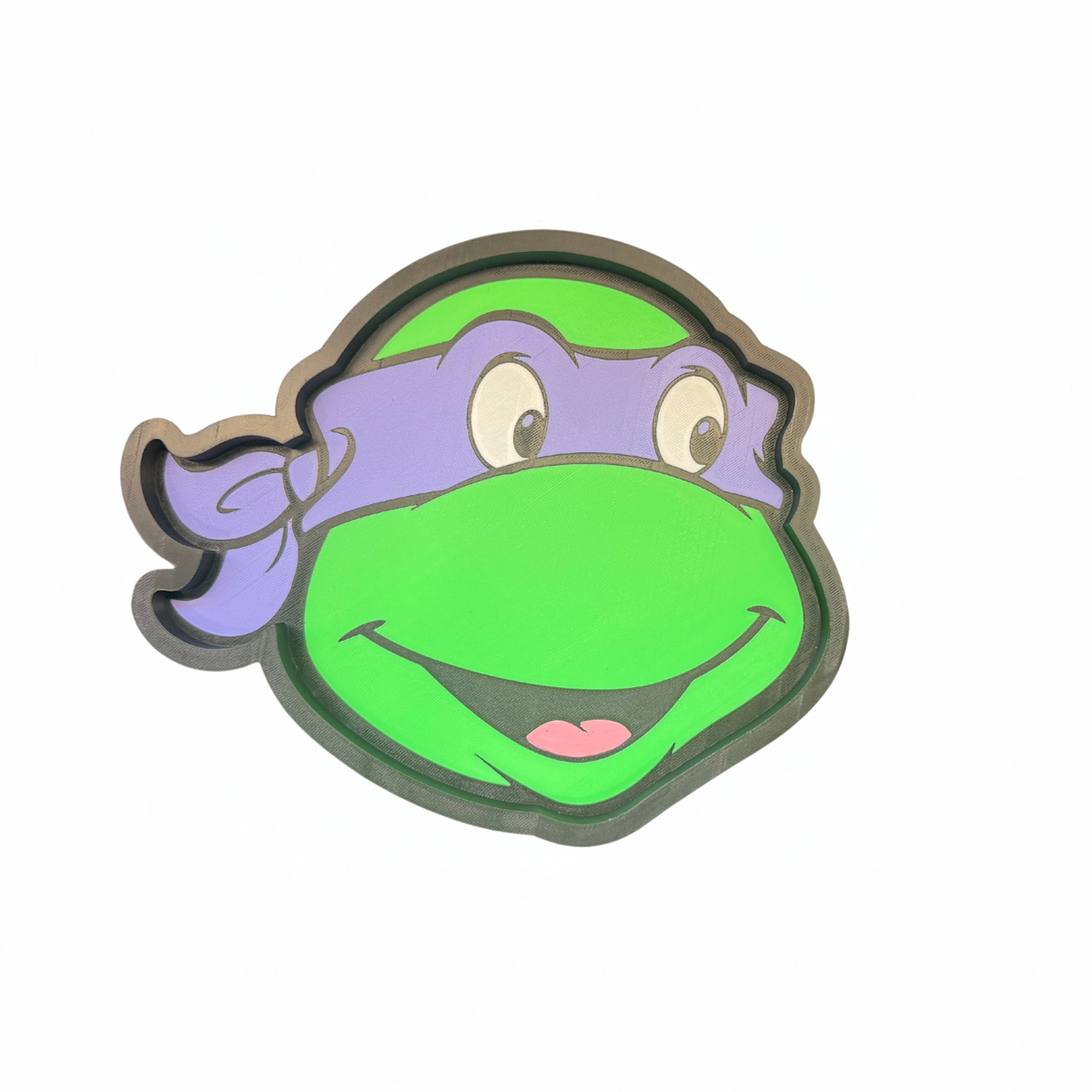 Purple and green Teenage Mutant Ninja Turtles character face-shaped trinket tray on a white background