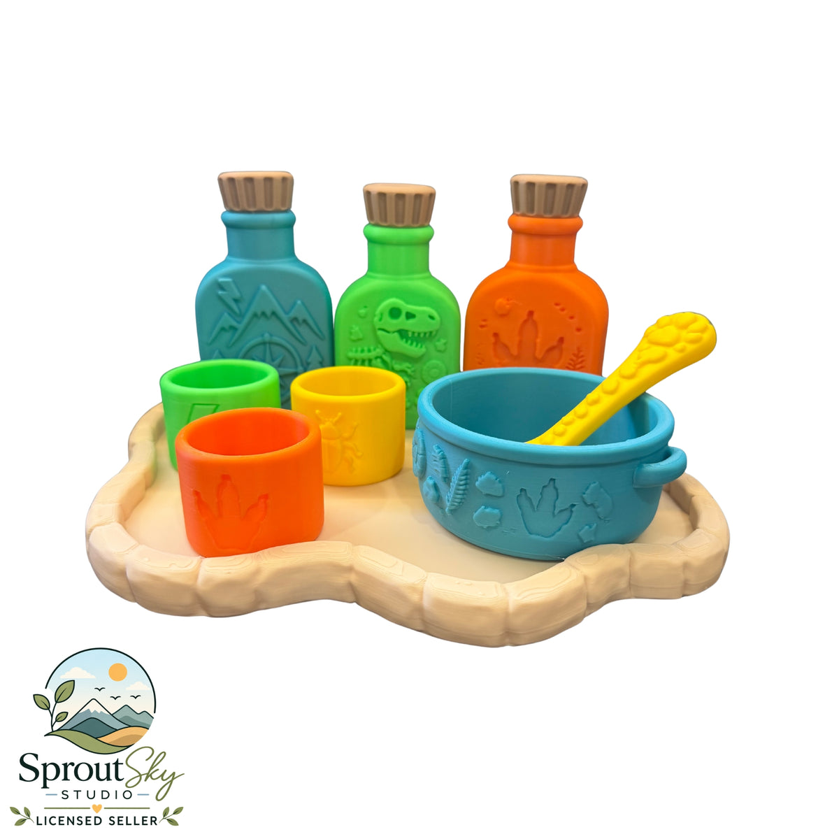 Dinosaur potion set with three embossed bottles, mixing cups, bowl and spoon on a bone-shaped tray