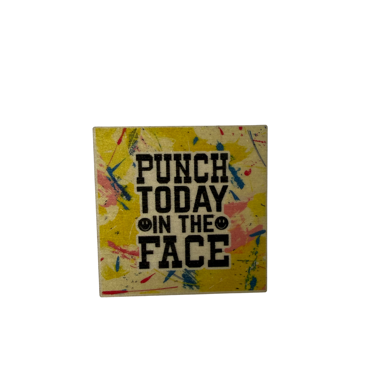 Square magnet with Punch Today in the Face lettering and smiley faces on a yellow background with colourful paint-splash details.
