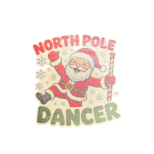 North Pole Dancer wooden Christmas magnet featuring Santa dancing with a candy-striped pole surrounded by snowflakes
