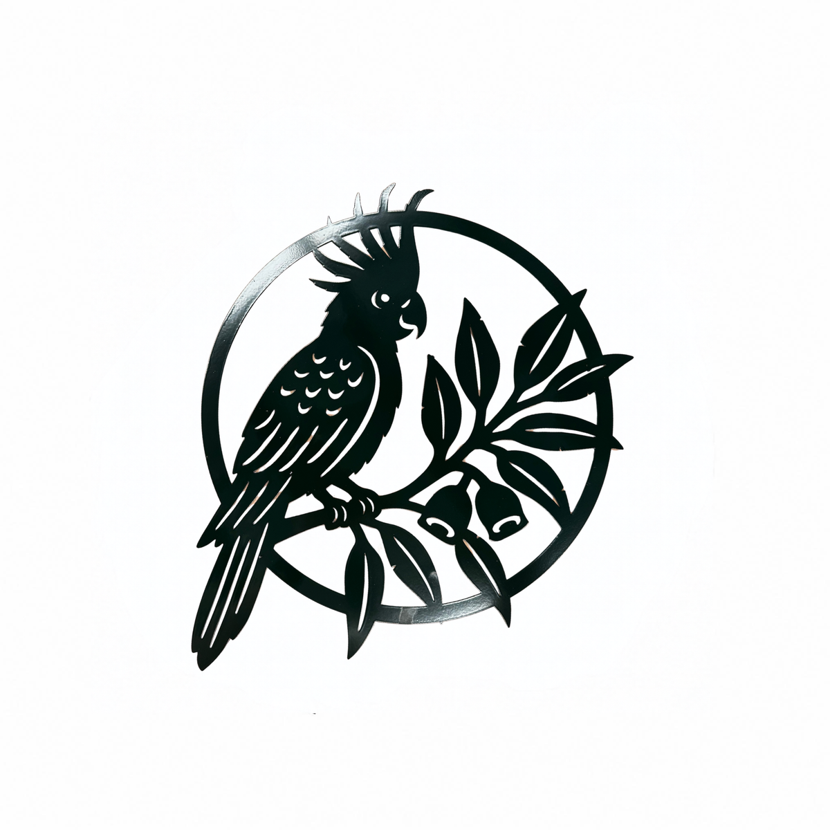 Cockatoo metal wall art, a black laser-cut silhouette of a cockatoo on a eucalypt branch within a circular frame, on a white background