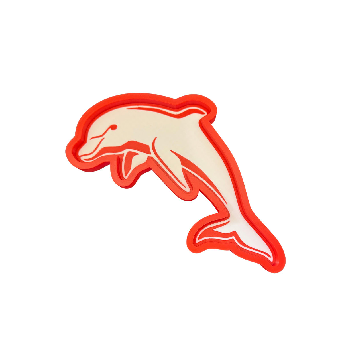 Dolphins-inspired red and white dolphin-shaped trinket tray on a white background
