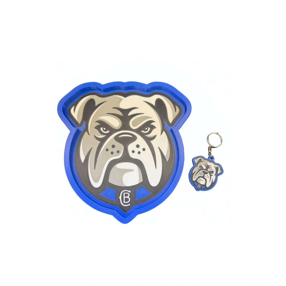 Matching blue-edged bulldog trinket tray and keyring set on a white background