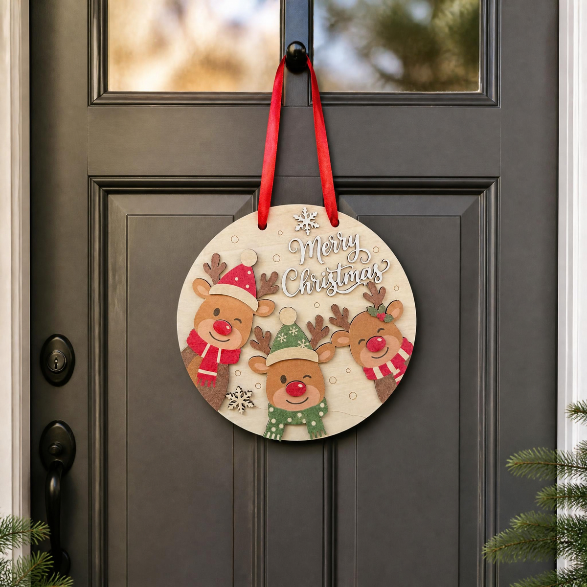 Mockup of the Merry Christmas wooden reindeer door hanger displayed on a dark door