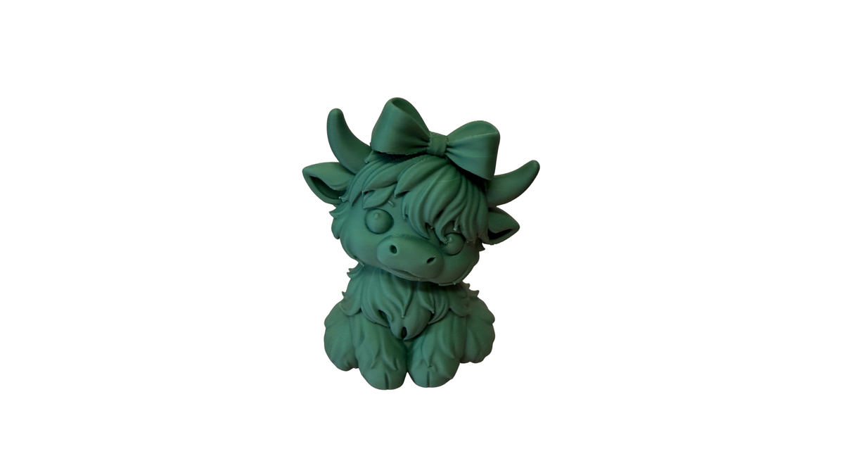 Green 3D printed highland cow figurine with bow, on white background