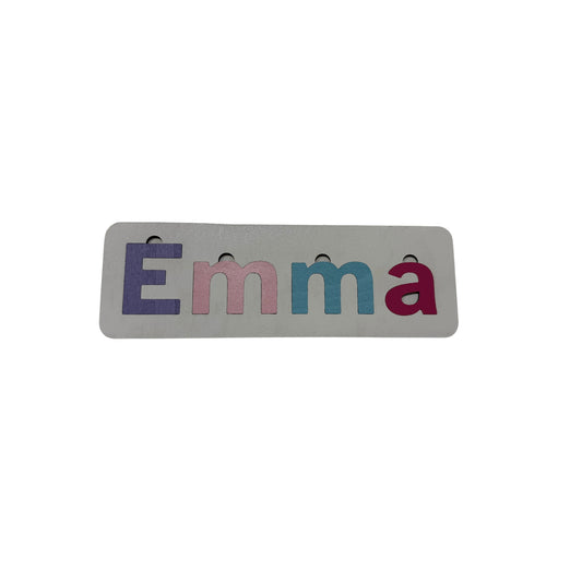 Personalised name puzzle with colourful letters on a white base
